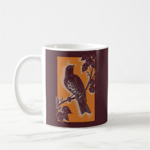 brown thrush with orange coffee mug