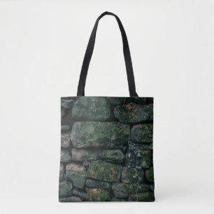 Brown vines on stacked stone blocks tote bag