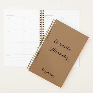 Brown with black text day planner and name place.