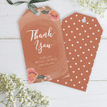Brown Wood Rustic Floral Bridal Shower Thank You Gift Tags<br><div class="desc">Adorn your favour gifts with a personal touch; this rustic bridal shower gift tag features the word "Thank You" and lovely floral against a brown wood pattern background. Check out other matching rustic wedding and bridal items here http://www.zazzle.com/collections/brown_wood_rustic_floral_wedding_collection-119146535042869019?rf=238364477188679314 Personalise it by replacing the placeholder text. For more options such as...</div>