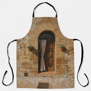 BROWN WOODEN DOOR ON BROWN BRICK WALL APRON