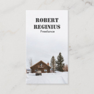 brown wooden house on snow covered ground business card