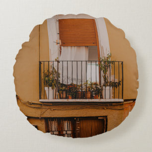 BROWN WOODEN WINDOW FRAME WITH GREEN PLANTS ROUND CUSHION