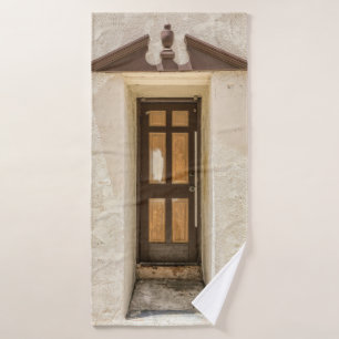 BROWN WOODEN WINDOW ON WHITE CONCRETE WALL BATH TOWEL