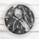 Brush Script Love Custom Photo Keepsake Round Clock<br><div class="desc">This keepsake clock features your favourite photo with the word 'Love' overlaid in a romantic white decortive brush script.  Order for yourself or as a special gift for someone you love.</div>