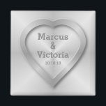 Brushed stainless steel wedding magnet<br><div class="desc">A wedding design for a modern wedding. This design has the look of brushed, polished steel or aluminium. There is a heart embossed on the design to look like pressed metal. The bride and grooms names can be edited to suit your needs. If you would like any help customising this...</div>