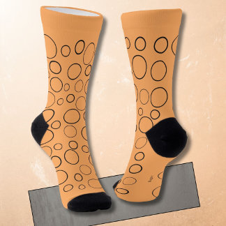 Bubbles and rings, black circles on orange socks