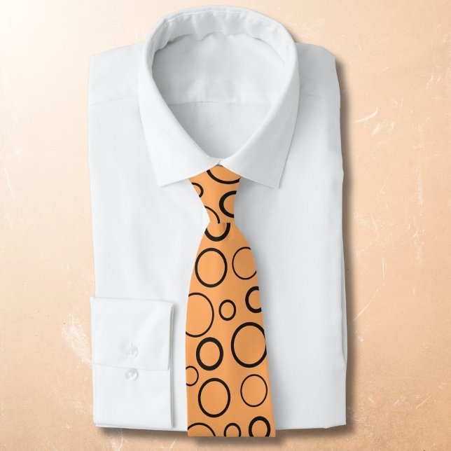 Bubbles and rings, black circles on orange tie (Creator Uploaded)