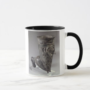 Bucchero vessel in the form of a leg with sculpted mug