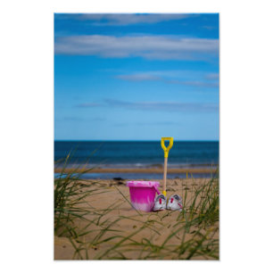 Bucket and spade on beach Photo print