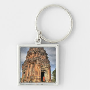 Buddhist monk standing in doorway of temple key ring
