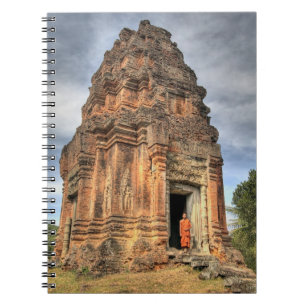 Buddhist monk standing in doorway of temple notebook