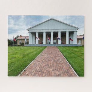 Building with white columns and brick path jigsaw puzzle