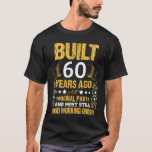 Built 60 years ago - 60th birthday present T-Shirt<br><div class="desc">A great T-Shirt for that fun-loving 60-year-old in your life! 
The dark background with a white and gold text design is an elegant touch for a great gift.</div>