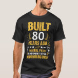 Built 80 years ago - 80th birthday present T-Shirt<br><div class="desc">A great T-Shirt for that fun-loving 80-year-old in your life! 
The black background with a white and gold text design is an elegant touch for a great gift.</div>