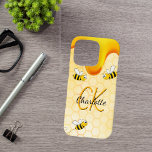 Bumble bees honeycomb honey dripping monogram iPhone 16 pro case<br><div class="desc">Yellow,  white background with a bee honeycomb pattern and happy smiling bumble bees. Decorated with sweet,  golden honey dripping. Personalise and add your name and monogram initials,  golden and black letters.  The name is written with a hand lettered style script.</div>