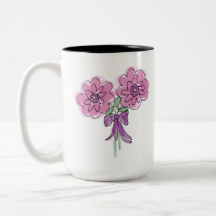 Bunch of two pink flowers with ribbon on mug