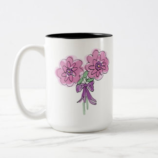 Bunch of two pink flowers with ribbon on mug