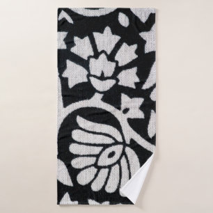 Bunches of plants and flowers abstract on a black  bath towel