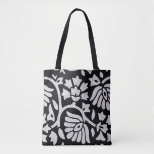 Bunches of plants and flowers abstract on a black tote bag