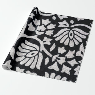 Bunches of plants and flowers abstract on a black wrapping paper