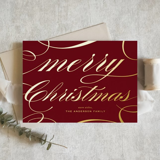 Burgundy Elegant Flourish Script Merry Christmas Foil Holiday Card (This burgundy Merry Christmas card features a beautiful flourish script in gold foil.)
