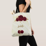 burgundy flowers gold leaves marble tote bag<br><div class="desc">elegant luxury burgundy flowers with some gold leaves on marble background tote bag</div>