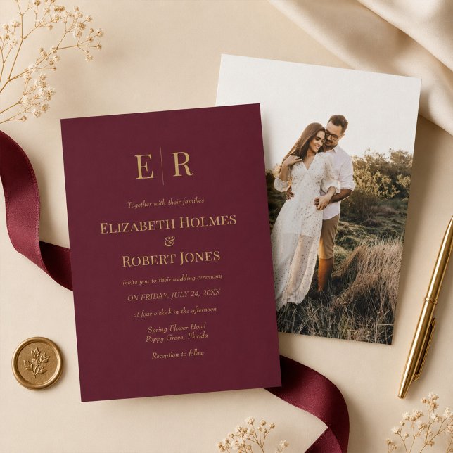 Burgundy Gold Monogram Custom Photo Wedding Invitation (Burgundy Gold Monogram Custom Photo Wedding Invitation on a table with elegant wedding decor)