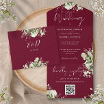 Burgundy Greenery QR Code Monogram Wedding All In One Invitation<br><div class="desc">All in one wedding invitation featuring botanical greenery rustic leaves,  and elegant typography on a burgundy background. The invitation includes a perforated RSVP card featuring a QR code. Designed by Thisisnotme©</div>