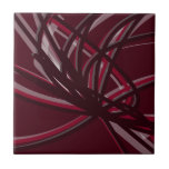 Burgundy & Grey Abstract Ribbons Ceramic Tile<br><div class="desc">Burgundy and grey tile features an artistic abstract ribbon composition with shades of burgundy wine maroon and grey with white accents on a burgundy wine coloured background.</div>