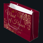 Burgundy Maroon & Gold Lace Maid of Honour Wedding Large Gift Bag<br><div class="desc">This beautiful gift bag is designed as a wedding gift or favour bag for the Maid of Honour. It features a beautiful burgundy, maroon, or wine red coloured background with golden faux foil lace curls and swirls in the corners. The gold script lettering reads "Maid of Honour" with a place...</div>