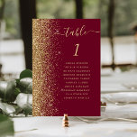 Burgundy Red Gold Glitter Wedding Table Number<br><div class="desc">The left-hand edge of this elegant modern wedding table number card features a gold faux glitter border. The word "table" appears in gold-coloured whimsical handwriting script on a burgundy red background. Add the names of your guests who are assigned to each table.</div>