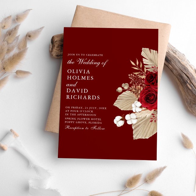 Burgundy Roses and Pampas Grass Wedding Invitation (Burgundy Roses and Pampas Grass Wedding Invitation on a table surrounded with pampas grass.)