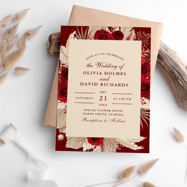 Burgundy Tropical Roses Wedding Invitation (Burgundy Tropical Roses Wedding Invitation on a table surrounded with pampas grass.)