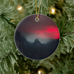Burning clouds, fog and mountains ceramic ornament