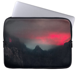 Burning clouds, fog and mountains laptop sleeve