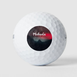 Burning clouds, fog and mountains monogram in sky golf balls