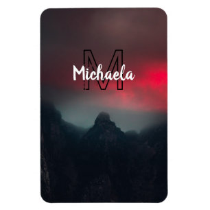 Burning clouds, fog and mountains monogram in sky magnet