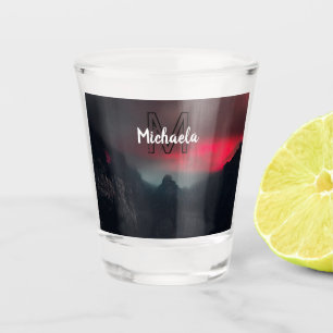 Burning clouds, fog and mountains monogram in sky shot glass
