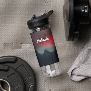 Burning clouds, fog and mountains monogram in sky water bottle