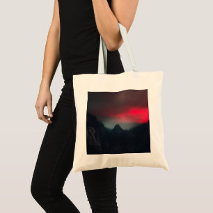 Burning clouds, fog and mountains tote bag
