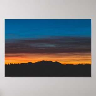 Burning sunset above landscape silhouette poster