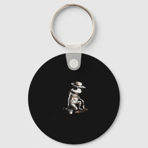 Bury things maybe plants maybe peole frog gardener key ring