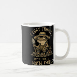 Bury things maybe plants maybe people funny frog coffee mug