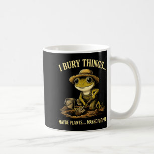Bury things maybe plants maybe people funny frog coffee mug