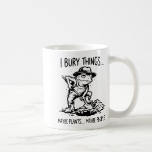 Bury things maybe plants maybe people funny frog coffee mug