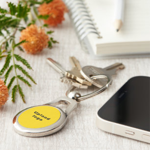 Business Logo With Yellow Background on Oval Metal Key Ring