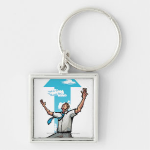 Businessman kneeling, arrow sign in the background key ring