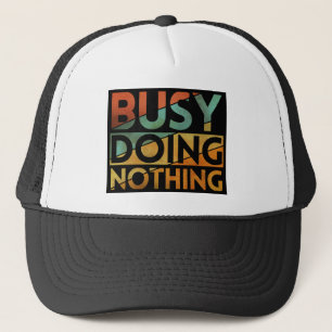 BUSY DOING NOTHING TRUCKER HAT