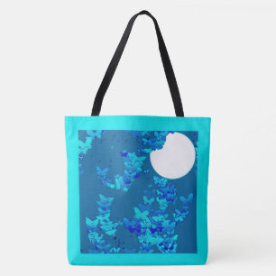 Butterflies against blue night sky, moonscape tote bag